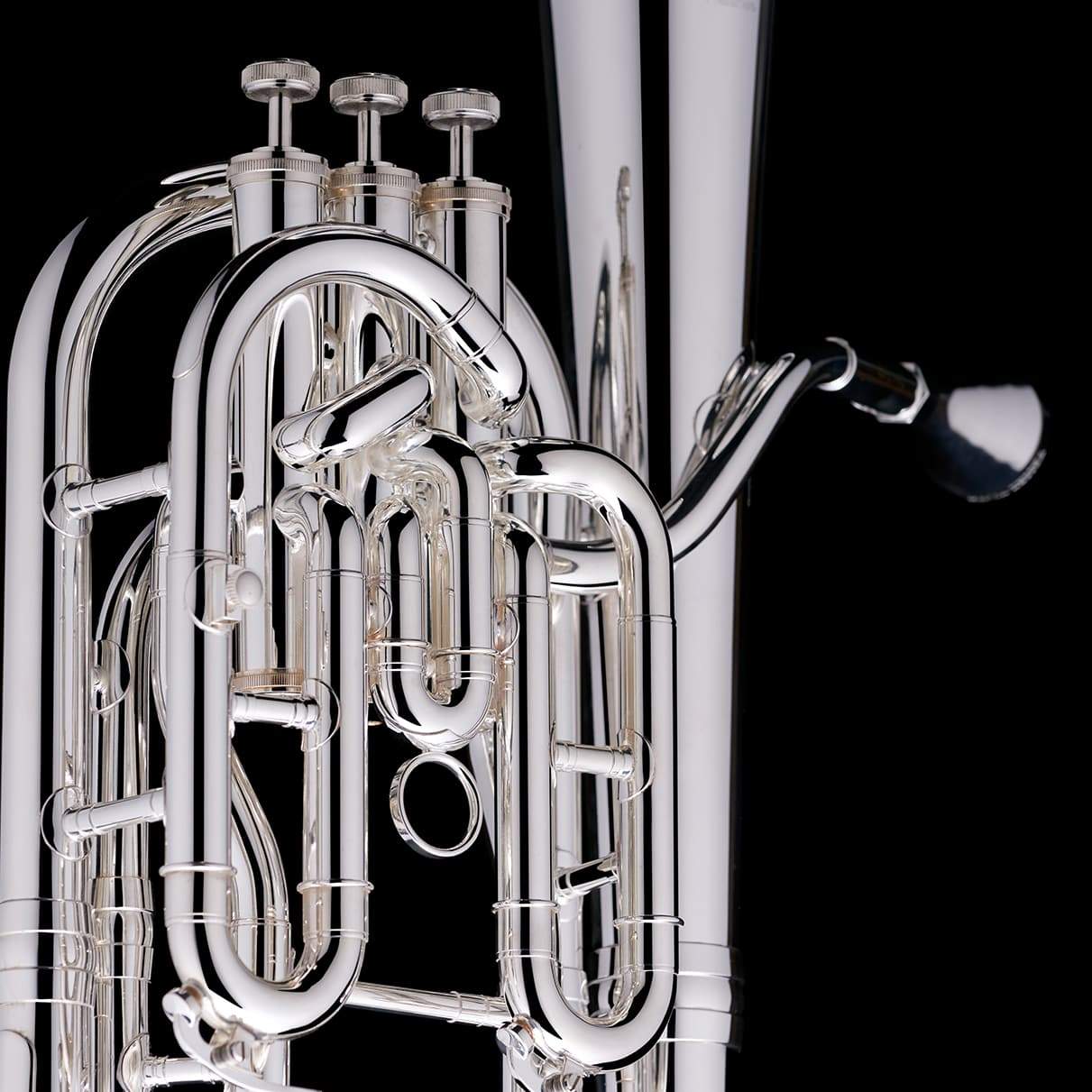 A close up image of the piston valves of a Bb Compensated Baritone (3-valve) from Wessex Tubas in silver-plate