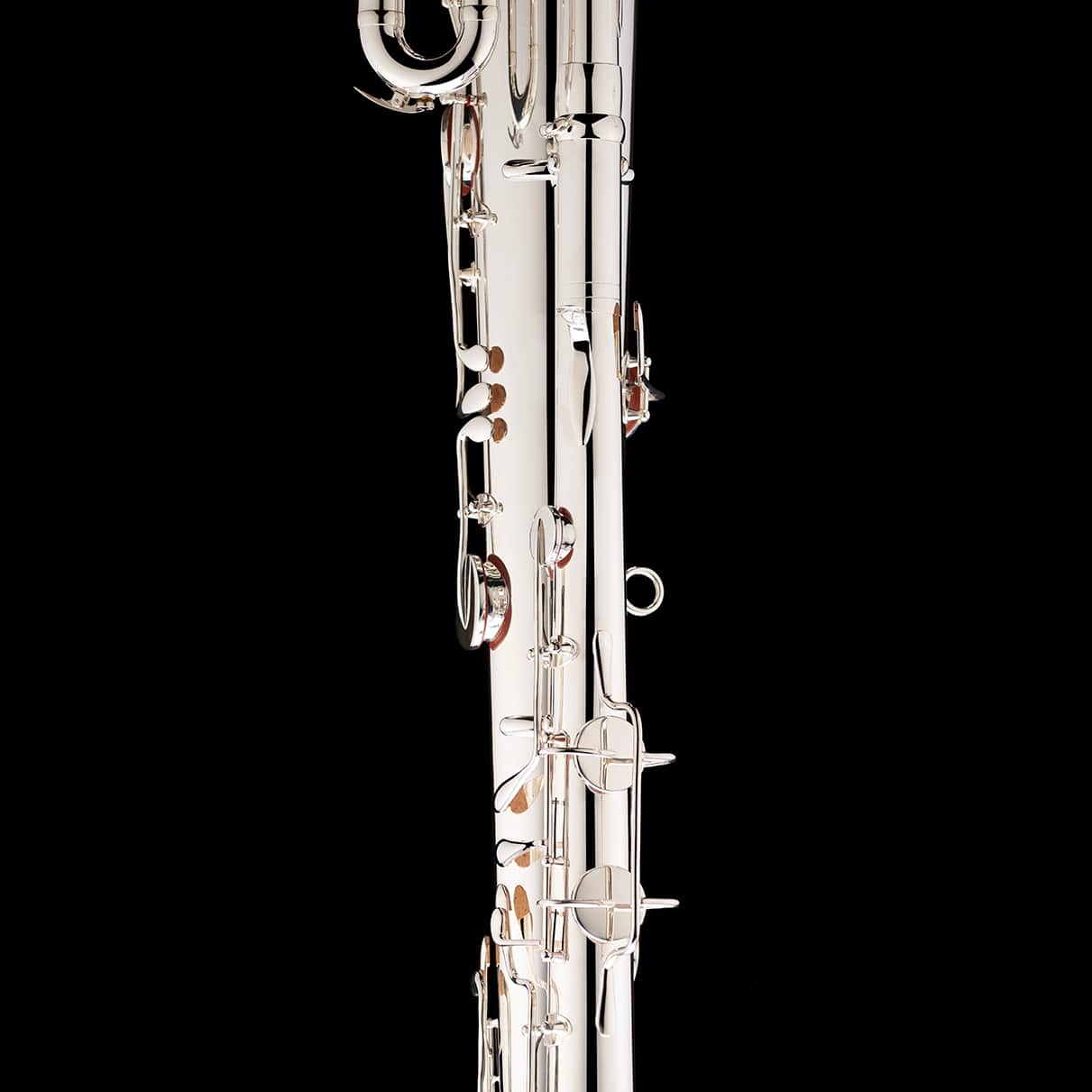A close up image showing the detailed craftsmanship of a Bb Ophicleide in silver from Wessex Tubas