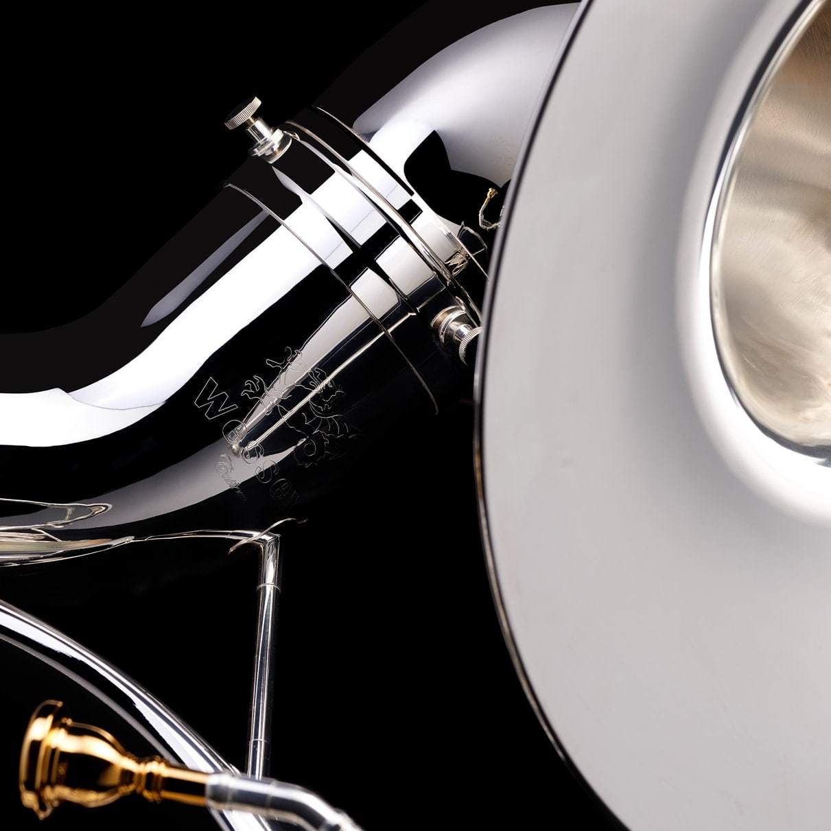 A close up image of the engraving on, and mouthpiece of, a Eb Sousaphone (4-valve) from Wessex Tubas