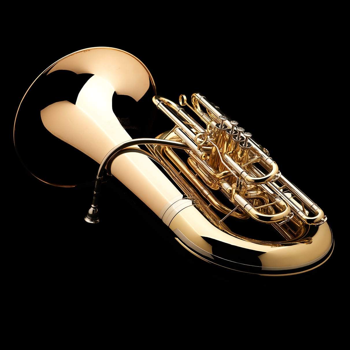 An image of the back of a BBb 4/4 Tuba with 5-valves 'Viverna' from Wessex Tubas, laying on its side