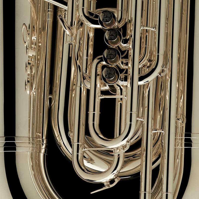 A close up image of the engravings on the valves of a BBb 6/4 Front-Piston Tuba "Grand" from Wessex Tubas