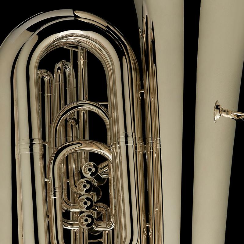 A close up image of a BBb 6/4 Front-Piston Tuba "Grand" in silver from Wessex Tubas