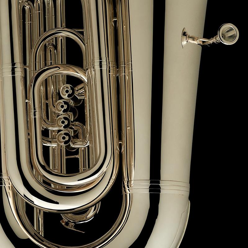 A close up image of the exceptional craftsmanship of a BBb 6/4 Front-Piston Tuba "Grand" in silver-plate from Wessex Tubas
